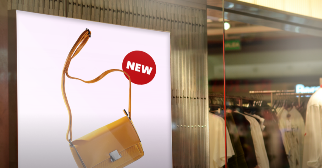 digital screen in a retail store showing a new bag
