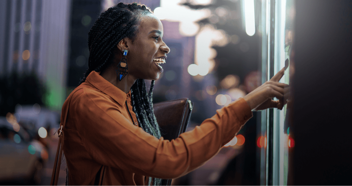 Woman interacting with a touchscreen display