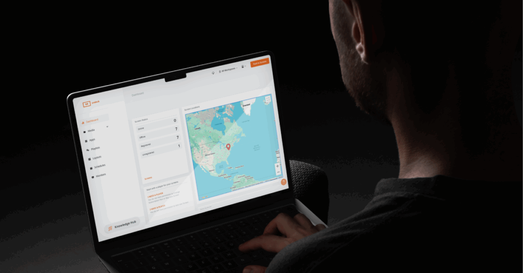 A person in a laptop controlling his screens